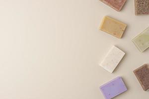 Soap on beige background. Flat lay, copy space. photo
