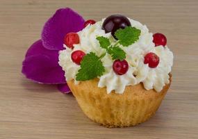 Cupcake on wooden background photo