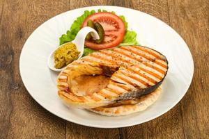 Grilled salmon on wood photo