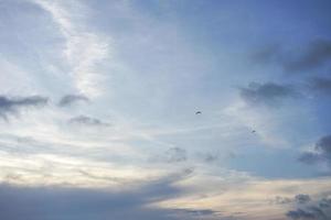 The emptiness and freedom of the blue sky and clouds with copy space for banner or wallpaper background photo