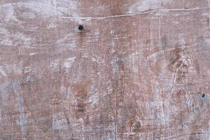 Old painted wood brown wall texture, textured wooden reddish surface background, dark dry stained board, grunge weathered panel, retro-styled obsolete wood, vintage and rustic, copy space. photo