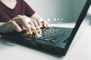 Concept of customer satisfaction and service, businesswoman using laptop to express their opinions, answers and satisfied scores. photo