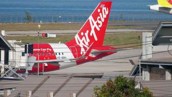 PHUKET, THAILAND DECEMBER 3, 2018 - AirAsia Airbus A320 HS BBH pushing back before departure. video