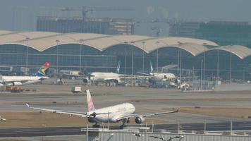 HONG KONG NOVEMBER 10, 2019 - China Airlines accelerates and takes off at Chek Lap Kok International Airport. video