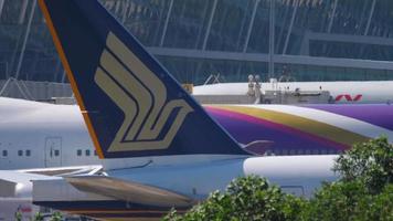 PHUKET, THAILAND NOVEMBER 14, 2019 - Singapore Airlines taxiing before departure from Phuket airport, close up tail video