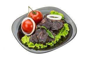 Horse sausages on the plate and white background photo