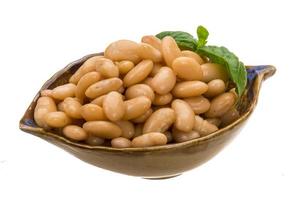 Tinned bean in a bowl on white background photo