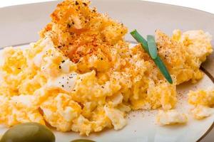 Scrambled eggs on the plate photo