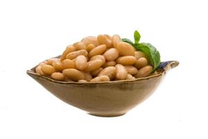 Tinned bean in a bowl on white background photo