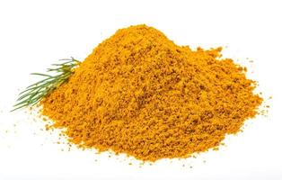 Curry powder on white photo