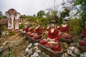 Old temple with numerous of old Image of Buddha on mountain in Mingun, Sagaing Region, Myanmar photo