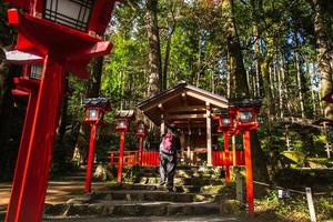 Kurama, Kyoto Prefecture, Kansai, Japan - November 21, 2019 - Tourists visit to Kibune Shrine Yuinoyashiro on mount Kurama photo