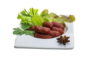 Salami sausages on white photo