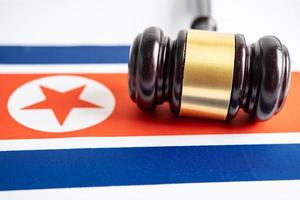 North Korea flag with gavel for judge lawyer. Law and justice court concept. photo