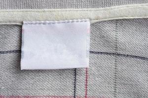 laundry care clothing label on fabric texture photo