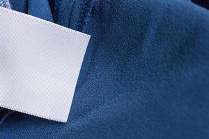 laundry care clothing label on blue dress photo