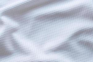 Ropa deportiva blanca tela camiseta de fútbol jersey textura resumen antecedentes foto