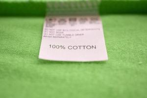 White laundry care washing instructions clothes label on cotton shirt photo