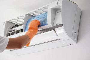 Asian man hand hold air conditioner filter cleaning concept photo