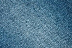 Denim blue jeans texture close up background top view photo