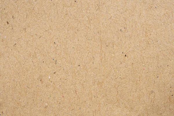 Recycled craft paper texture. Brown cardboard sheet paper