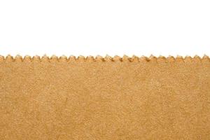 Close up brown paper bag texture isolated on white background photo