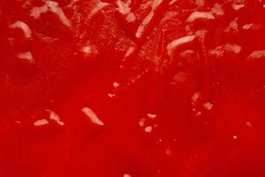 Tomato sauce ketchup texture background close up photo