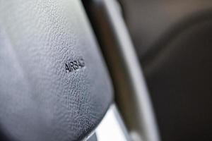 Safety airbag sign on car steering wheel photo