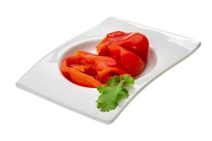 Marinated pepper on white photo