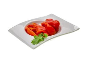 Marinated pepper on white photo