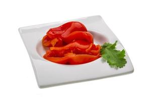 Marinated pepper on white photo