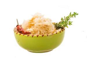 Fermented cabbage on white photo