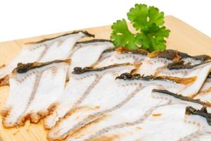 Sliced eel on white photo