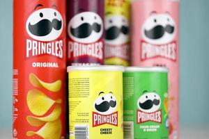 KHARKIV, UKRAINE - DECEMBER 16, 2021 Pringles product with new logo. Pringles is a brand of potato snack chips owned by the Kellogg Company photo