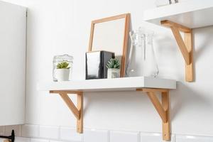 kitchen shelves with frames and decorations photo