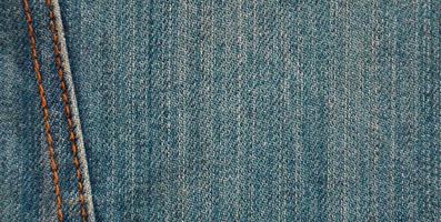 Detailed texture of dark denim cloth photo