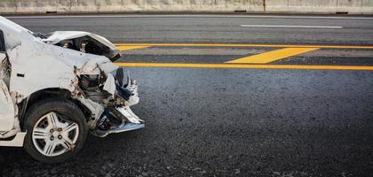 car crash damaged from accident on highway road photo