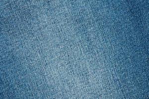 Denim blue jeans texture close up background top view photo