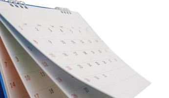 White paper desk calendar isolated on white background photo