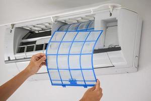 man hand hold air conditioner filter cleaning concept photo