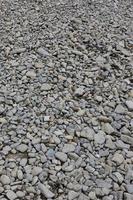 Texture of many crushed stones. Crushed stone is a solid base material for foundation photo