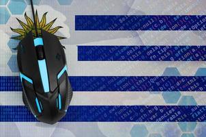 Uruguay flag  and computer mouse. Digital threat, illegal actions on the Internet photo