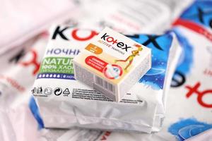 KHARKIV, UKRAINE - DECEMBER 16, 2021 Kotex production with logo. Kotex is a brand of feminine hygiene products, includes maxi, thin and ultra thin pads. photo