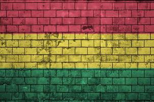 Bolivia flag is painted onto an old brick wall photo