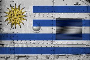 Uruguay flag depicted on side part of military armored tank closeup. Army forces conceptual background photo