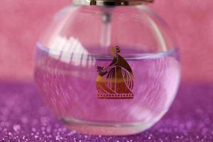 TERNOPIL, UKRAINE - SEPTEMBER 2, 2022 Lanvin Eclat Darpege perfume bottle on shiny glitter background in purple colors photo