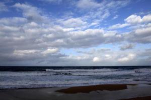 Large rain clouds in the sky over the sea. photo