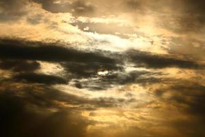 Large rain clouds in the sky over the sea. photo