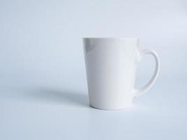 White coffee cup top view photograph On a white saucer The inside of the glass looks empty. Waiting for hot coffee to be refilled to drink to feel refreshed and alert on a white background. photo