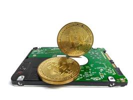 Computer hard drive and bitcoin crypto isolated on white background photo